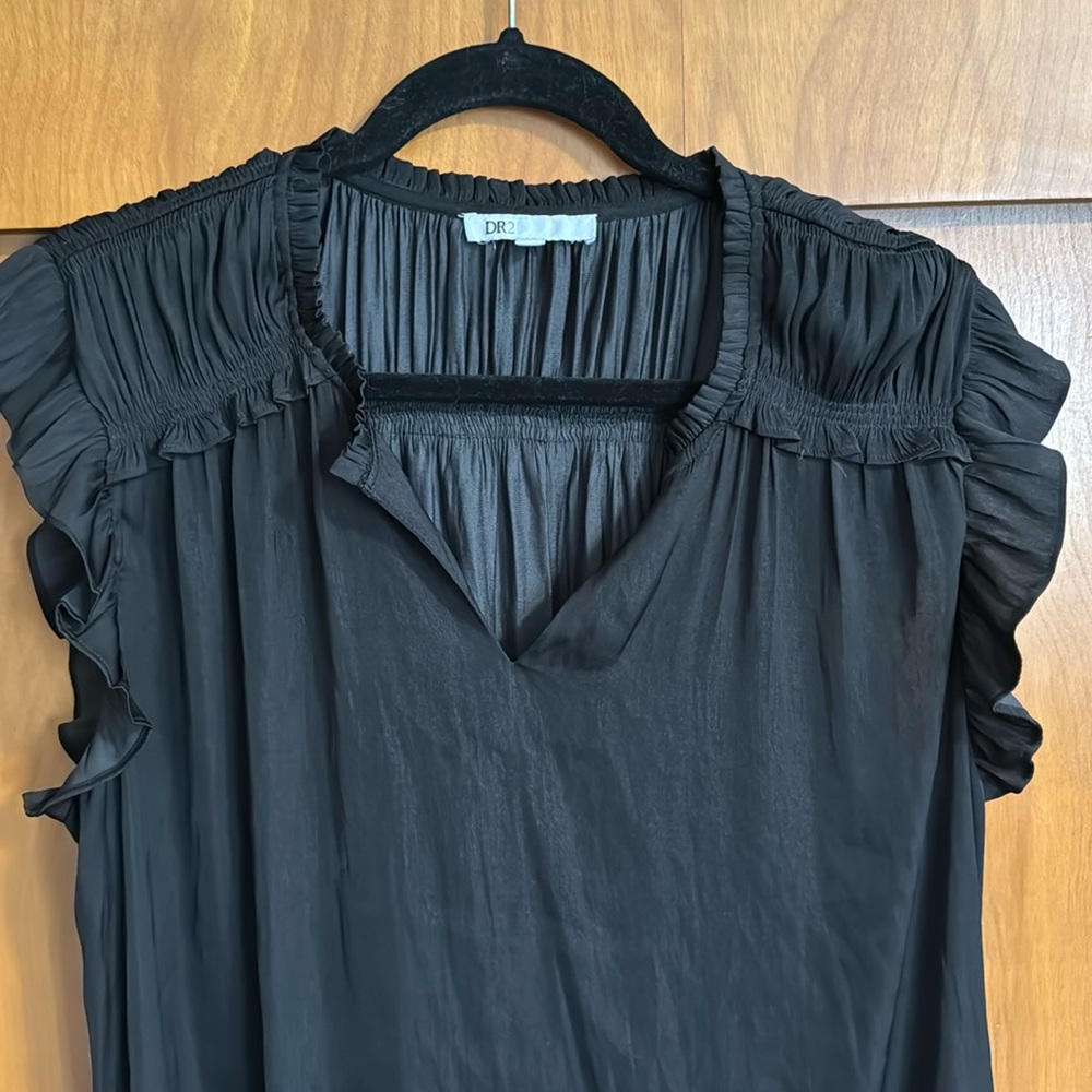 Black feminine top with ruffle accents. XL